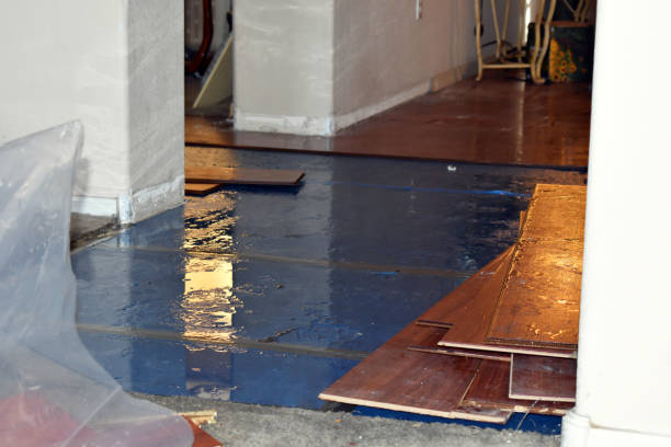 Professional Flood Damage Restoration technician working in Cleveland, WI